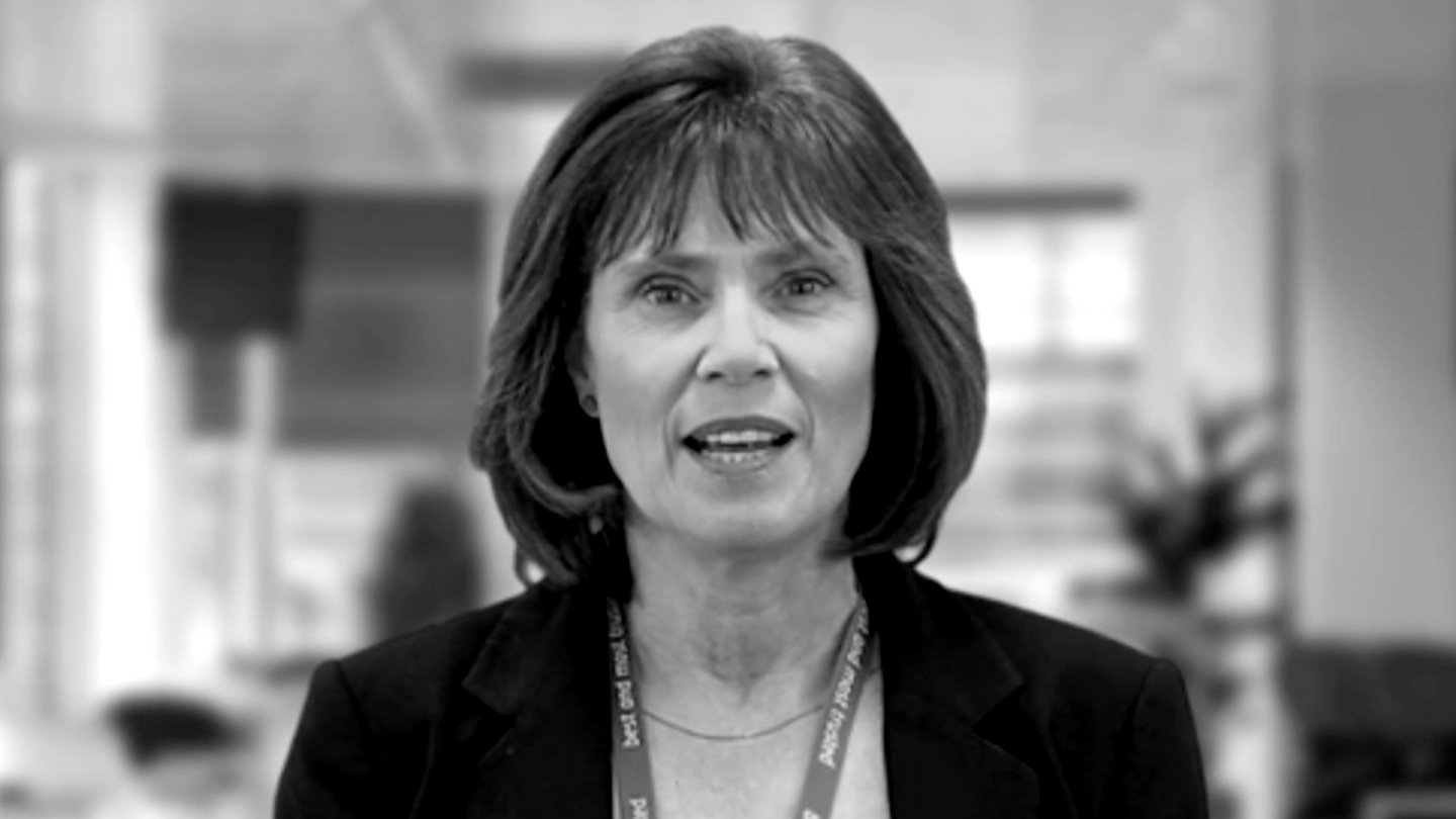 Maggie Saunders speaking during a filmed performance